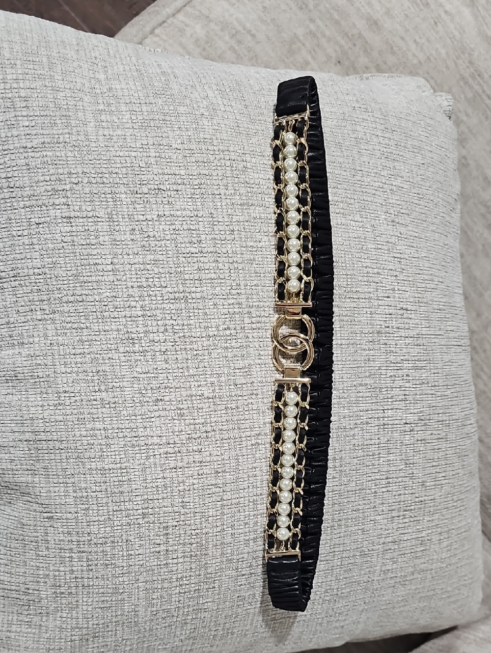 Chanel, an elastic black leather, imitation pearl and metal belt,Sz 70/32